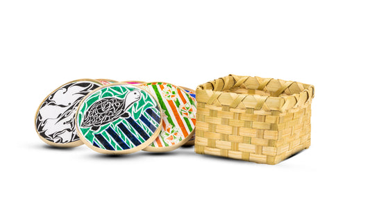 A set of handcrafted bamboo coasters with a geometric pattern, accompanied by a natural bamboo case.