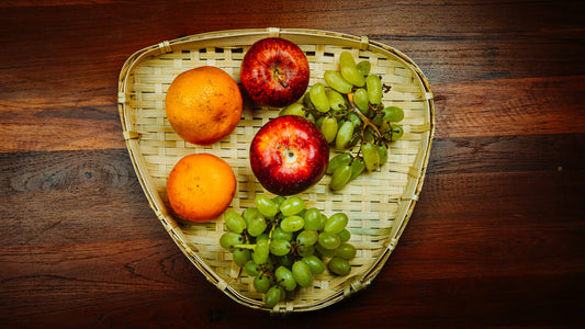 Triangular Fruit tray on dining table with fruits