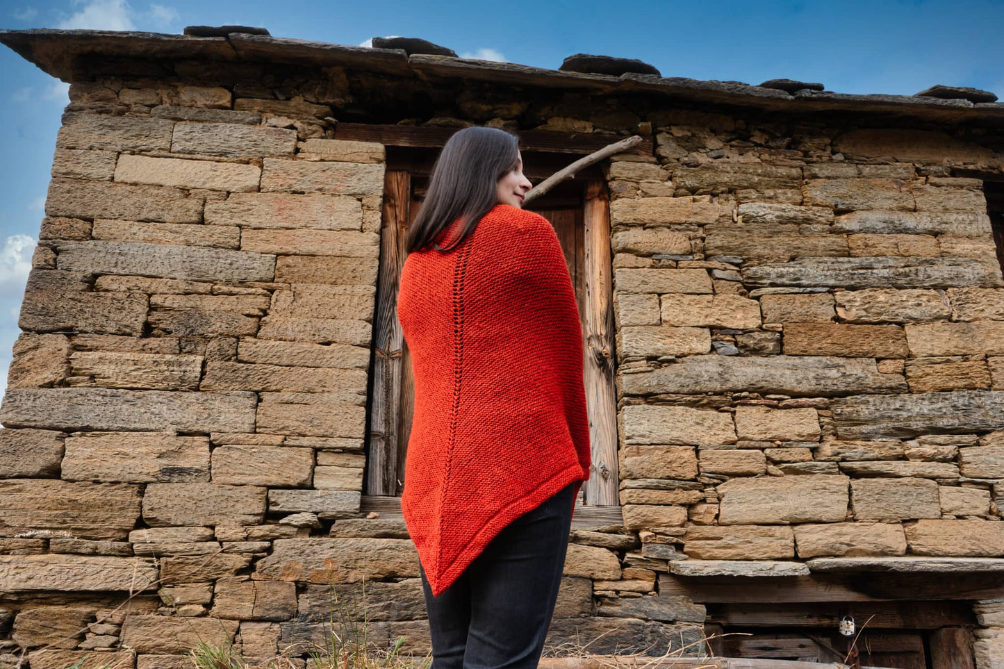 Handknitted textured shawl behind