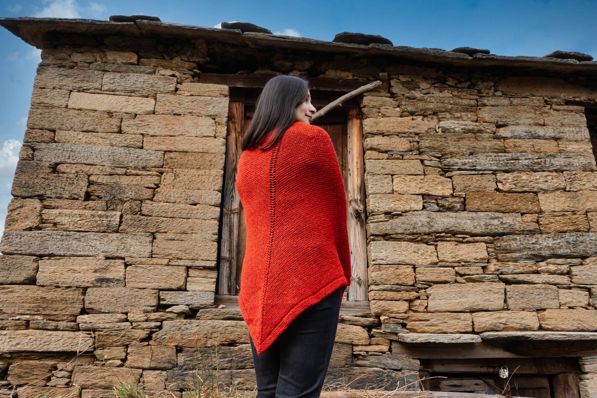 Handknitted textured shawl behind