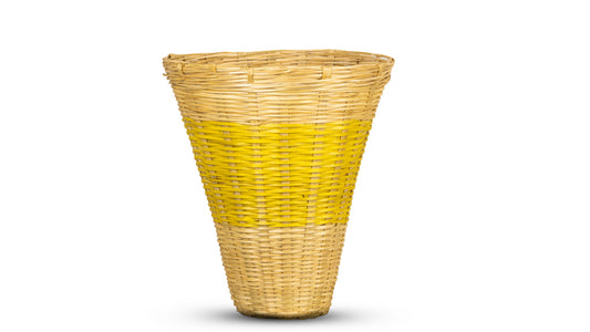 A conical wall basket with a beige color upper part and a yellow color lower part.