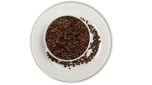 A plate full of Horse Gram (Gahat) dal, with some dal scattered on the surface of the plate.
